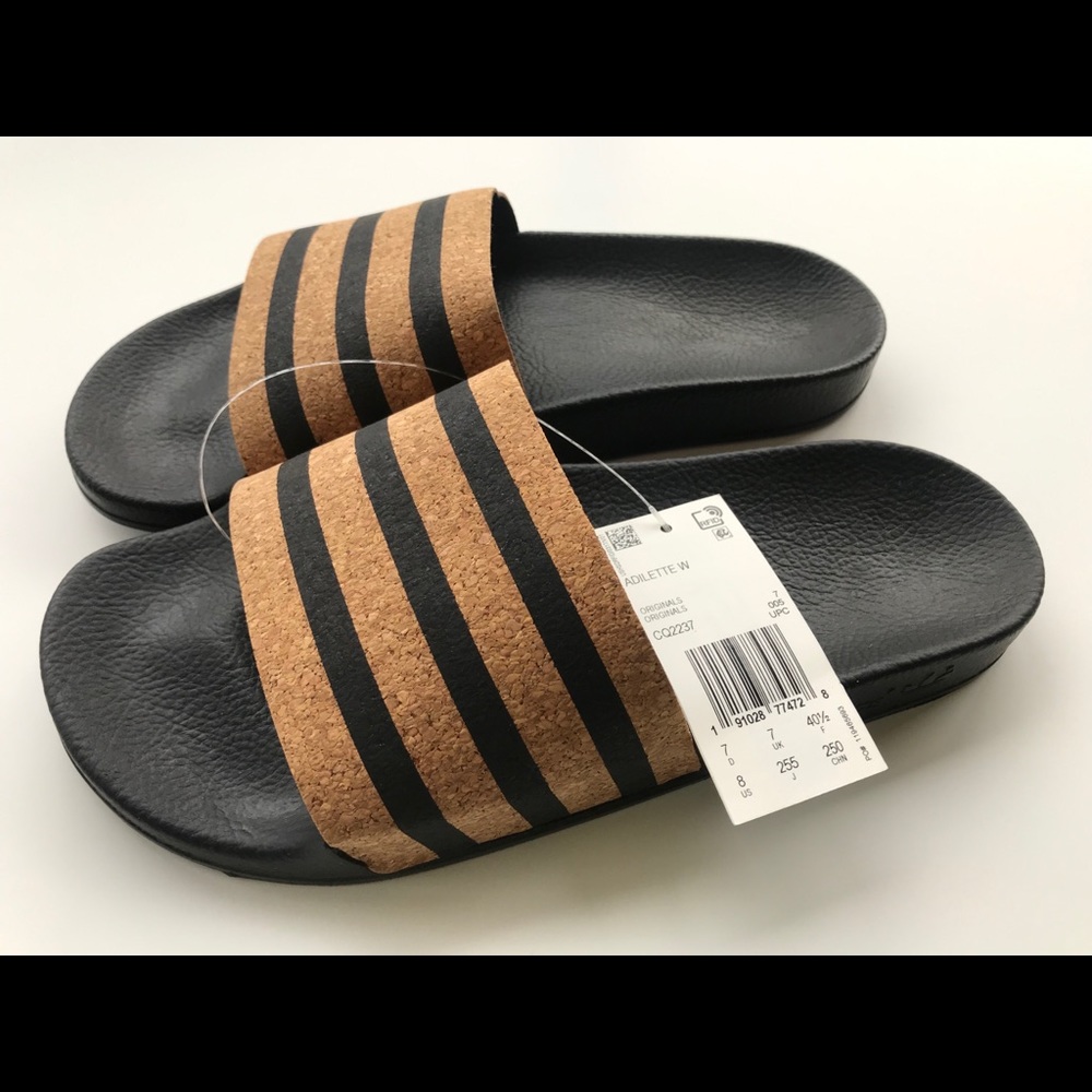Adidas Adilette cork slides sandals.